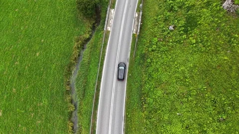 Auto riding through scenic landscape and natural beauty of countryside Stockbeeldmateriaal 339914837