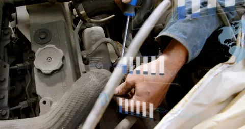 Auto tech hands inserting driver at plug or hose, prying clamp under hood, Stock Footage 332275470