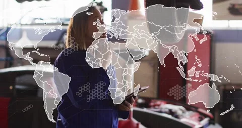 Auto tech holding phone, checking lifted wheel, reading data while world map Stock Footage 330208763