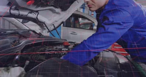 Auto tech leaning over engine bay scanning wiring and tuning intake while red Stock Footage 334315861