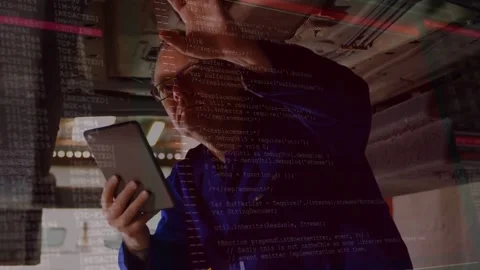 Auto tech tilting and tapping tablet, activating code overlay over underside Stock Footage 331701425