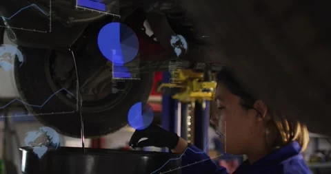 Auto technician placing drain pan catching oil as lift raising vehicle, blue 스톡 동영상 329946419