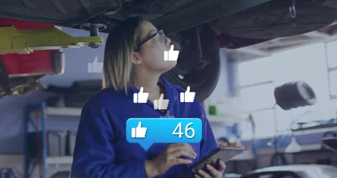Auto technician tapping tablet inspecting vehicle under lift getting animated Stock Footage 310153365