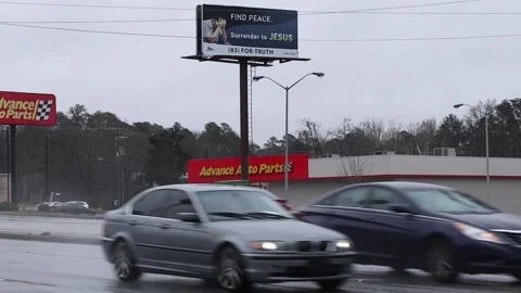 Auto Zone in the rain with traffic street view Stock Footage 148951679