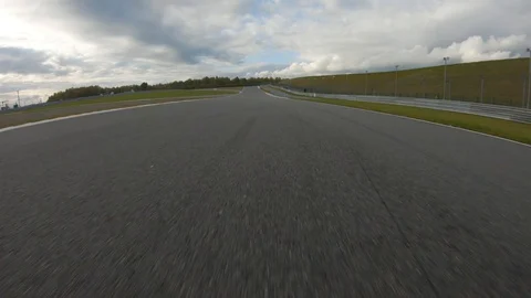 Autogrip. Car mounted camera pov shot as a car drives around raceway. Double Stock Footage 128403687