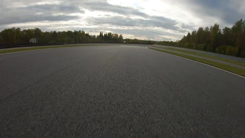 Autogrip. Car mounted camera pov shot as a car drives around raceway. Turn to Stock Footage 128403711