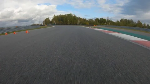 Autogrip. Car mounted camera pov shot as a car drives around raceway Stock Footage 128403732