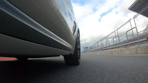 Autogrip. Car mounted camera pov shot. View at the front wheel Stock Footage 128403785