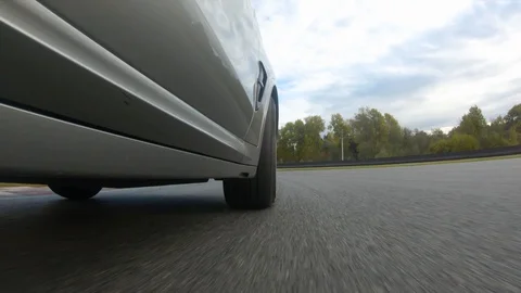 Autogrip. Car mounted camera pov shot. View at the front wheel Stock Footage 128403865