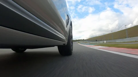 Autogrip. Car mounted camera pov shot. View at the front wheel Stock Footage 128403873