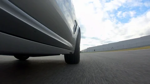 Autogrip. Car mounted camera pov shot. View at the front wheel Stock Footage 128403882