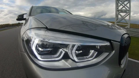 Autogrip. Car mounted camera view of the headlight Stock Footage 128403819