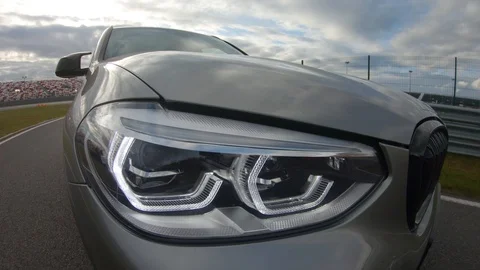 Autogrip. Car mounted camera view of the headlight Stock Footage 128403824