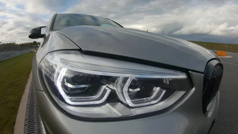 Autogrip. Car mounted camera view of the headlight Stock Footage 128403848