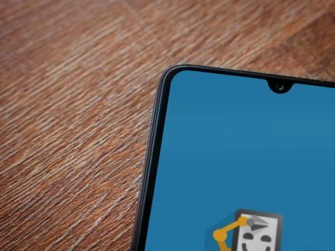 Automate app launch screen on smartphone on wooden background Stock Photos