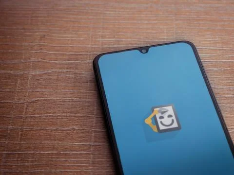Automate app launch screen on smartphone on wooden background Stock Photos