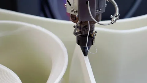 An automated 3D printer prints a plastic model. Stock Footage 288866098