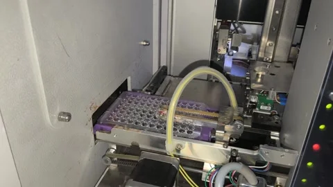An automated blood grouping analyzer performs precision sample testing Stock Footage 333295183