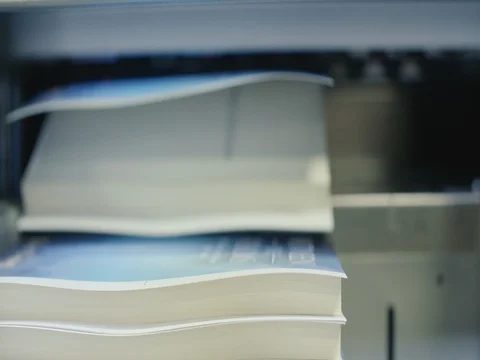 Automated Book Trimmer Machine Brings in Book for Cutting Stock Footage 80208425
