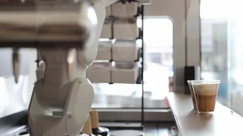 Automated cafe with robotic arm serving beverage. Video stock 330882952