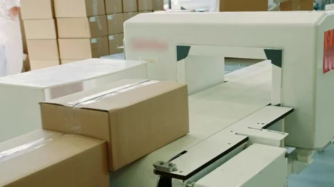 Automated candy packaging with workers in industrial factory interior Stock Footage 340604646
