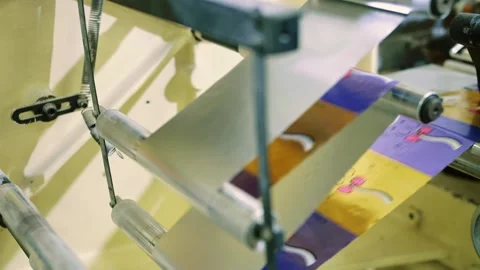 Automated candy wrapping machine operating inside candy factory Stock Footage 340604206