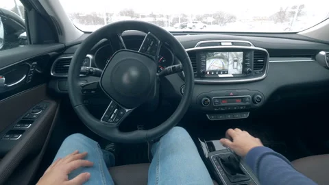 Automated car parks while a man sits inside, close up. Stock Footage 100565076