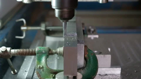 Automated CNC control numeric router cutting a piece of aluminum shaving Stockbeeldmateriaal 138739059