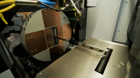 Automated CNC laser cutting machine processing a square metal pipe with bright Stock Footage 345892935
