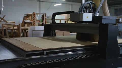 Automated CNC machine cutting OSB wood panels in a furniture factory Video stock 305597789