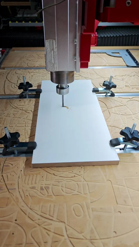 Automated CNC machine tool drilling precise patterns in industrial workshop Stock Footage 337246905