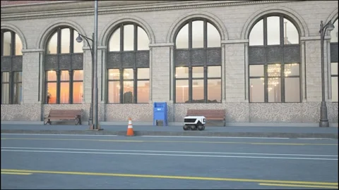 Automated Delivery Robot Service Driving on Urban Street Stock Footage 275053776