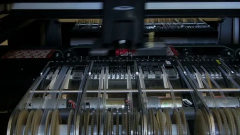 Automated device installing PCB, dolly shot, close up by Pakito. Stock Footage 71204102