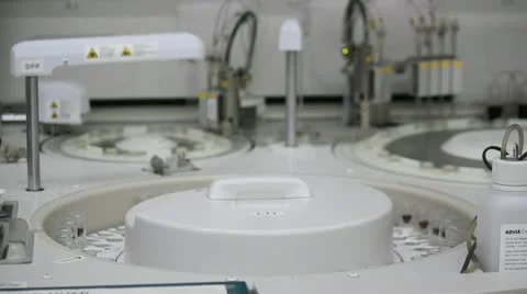 Automated device tests blood samples in medical laboratory Stock Footage 12448803