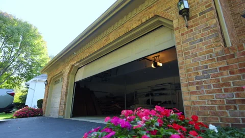 Automated garage Door opens and closes. Residential house. Outside footage. Wide Stock Footage 318631309