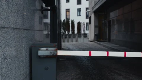 Automated Gate with Barriers in an Urban Area Captivating Real Time Footage in Stock Footage 299475751
