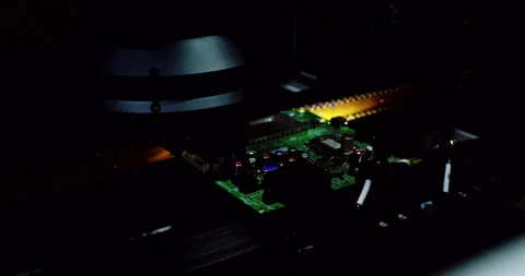 An automated high-precision machine assembles an electronic Stock Footage 332991333