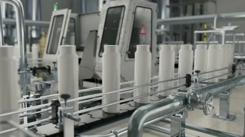 Automated industrial conveyor line sorting the shampoo bottles at the factory Stock Footage 237513255