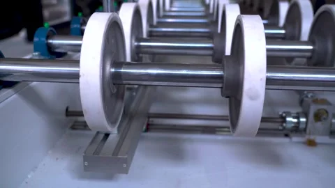 Automated industrial machine with rotating rollers on a production line 스톡 동영상 341553712
