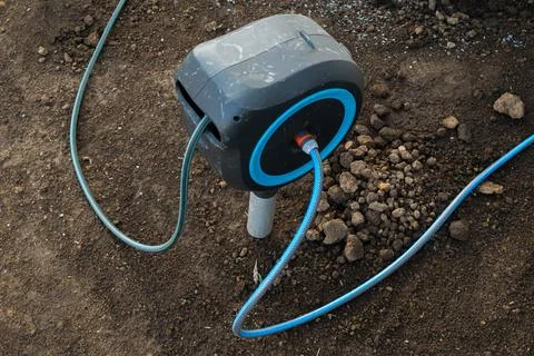 Automated irrigation system controller connected to water supply in Foto stock