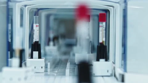Automated lab line. Many test tubes moving on holders in different directions Stock Footage 233128360