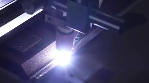 Automated laser welding machine cutting and joining stainless steel sheet with Stock Footage 334964419