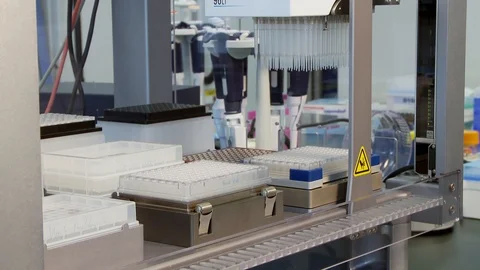 Automated liquid handling system pipetting moving plates medium Stock Footage 92623332