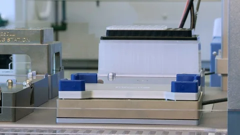 Automated liquid handling system plate on shaker close up Stock Footage 92623009