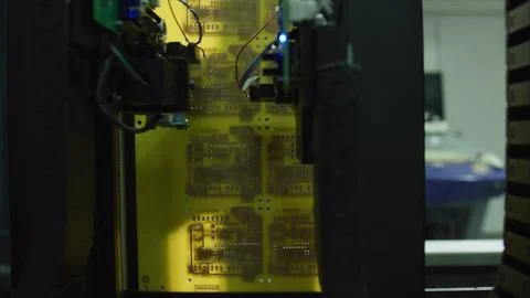 Automated machine assembling electronic circuit board in factory Stock Photos