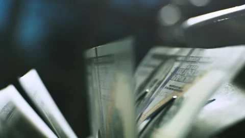 Automated machine counting hundred dollar bills quickly in modern banking e.. Stock Footage 337538566
