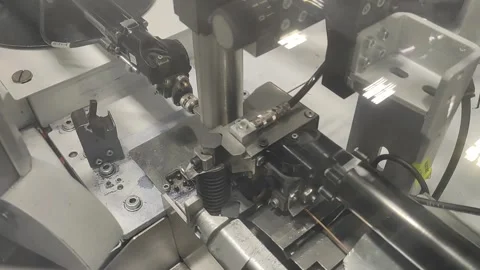Automated machine for crimping wires. Technologies. Industrial machines and bot Stock Footage 163791689