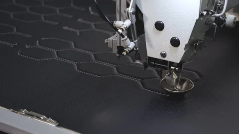 Automated machine embroider pattern on artificial leather. Robotics works in the Stock Footage 108065112