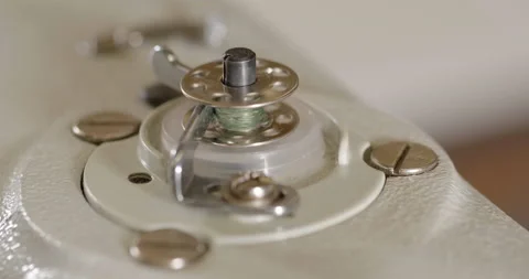 An automated machine embroiders pattern with red threads on black cloth Stock Footage 131134444