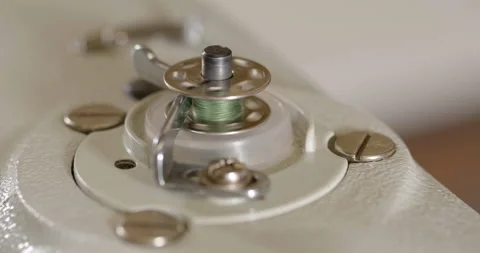 An automated machine embroiders pattern with red threads on black cloth Stock Footage 131134826